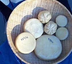 Rounds of homemade kefir cheese in a bamboo basket